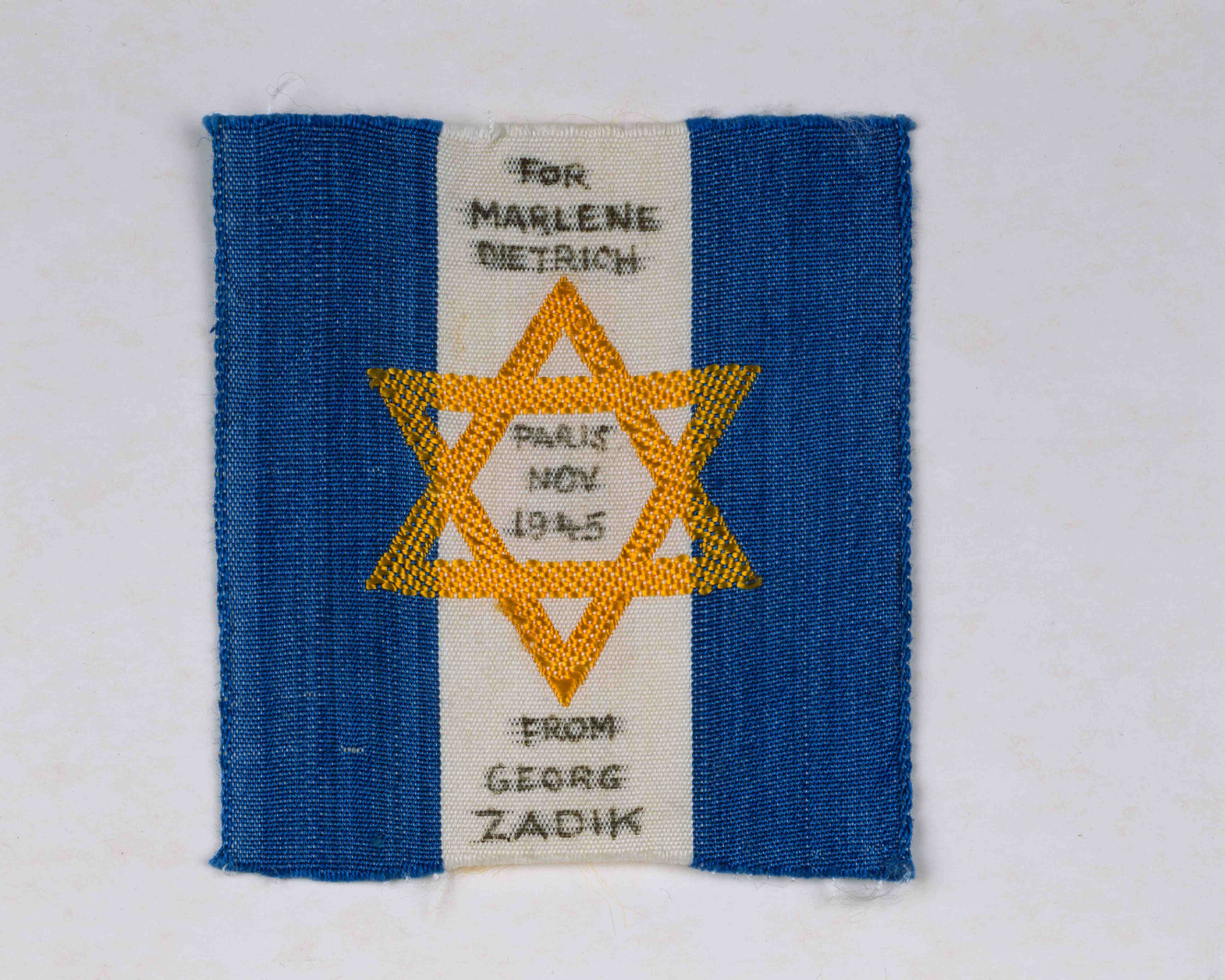 Fan gift to Marlene Dietrich: Badge with a Star of David and the dedication "For Marlene Dietrich – Paris Nov. 1945 – from Georg Zadik"