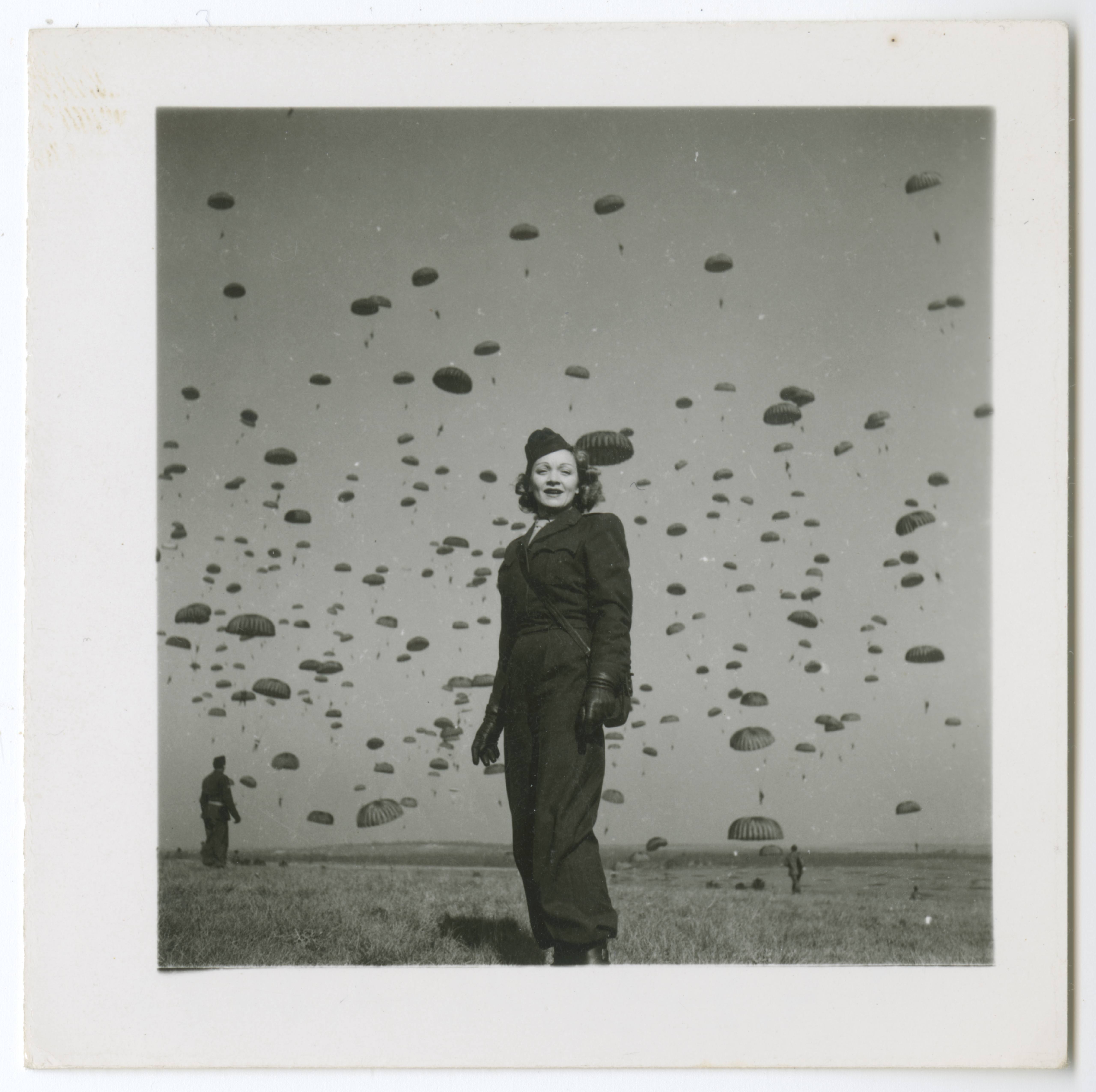 Marlene Dietrich on a paratrooper practice jump with the 82nd Airborne Division, Soissons in northern France, 13 March 1945
