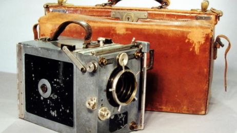 A historic 16mm camera with matching case.